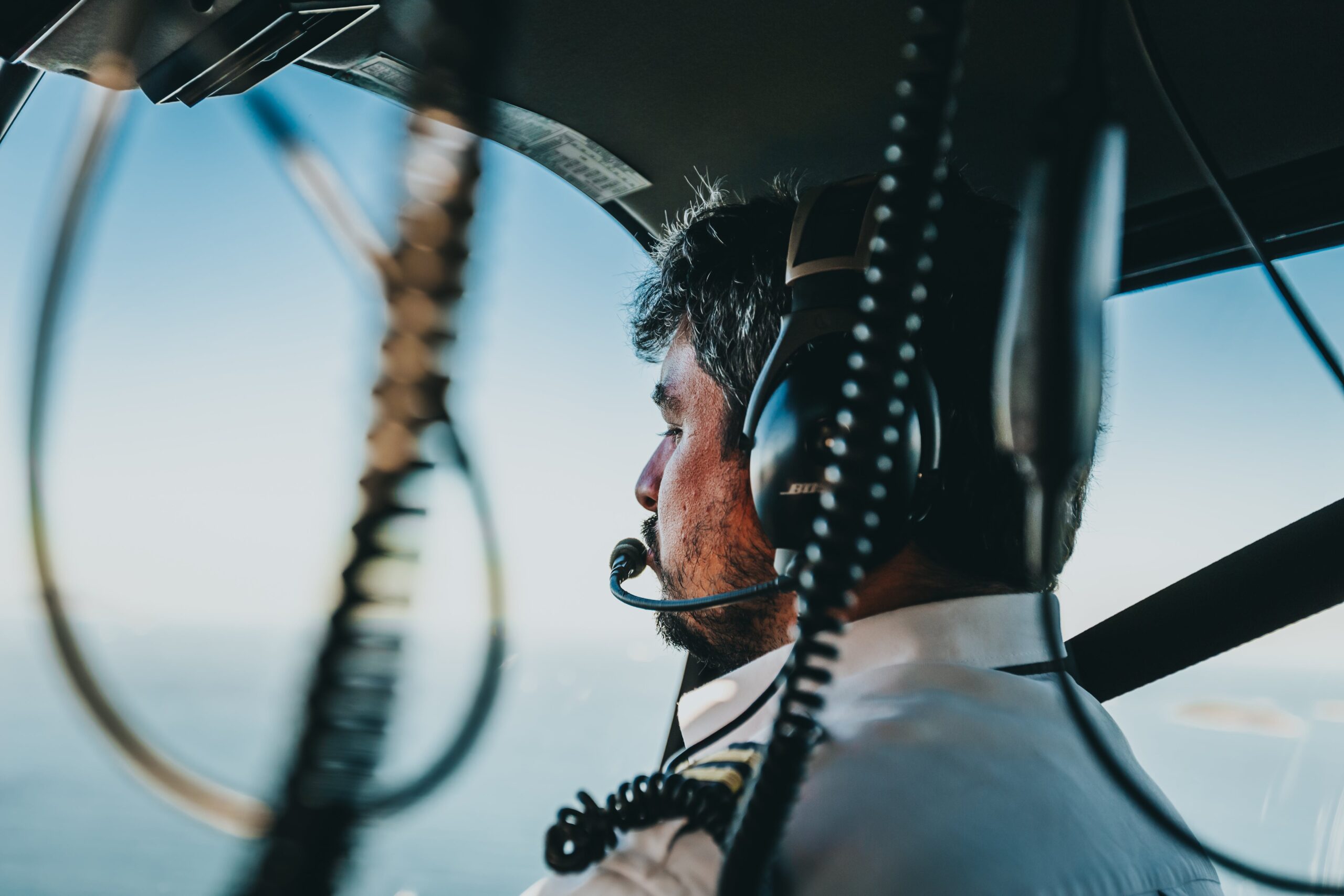 A pilot wearing a Bose headset