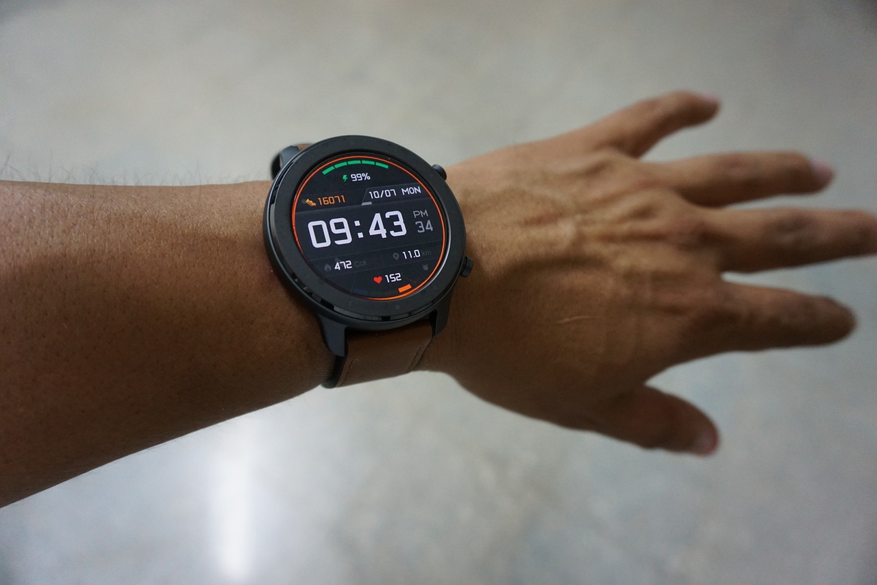 A close up of a smart watch on a man's wrist